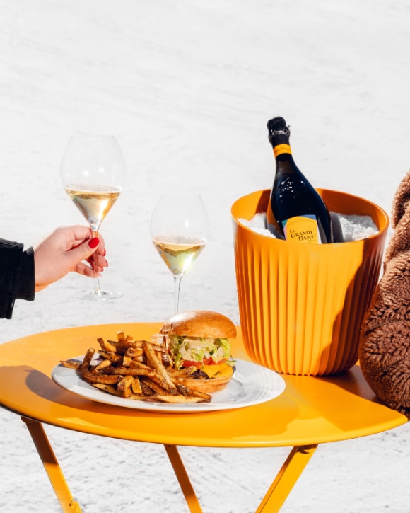 Veuve Clicquot Sunny Burger with La Grande Dame 2015 and two glasses in the snow