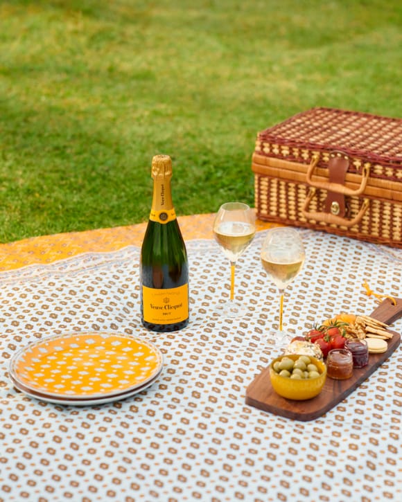 Veuve Clicquot Brut Yellow Label bottle with glasses and picnic food pairing Veuve Clicquot Brut Yellow Label bottle with glasses and picnic food pairing
