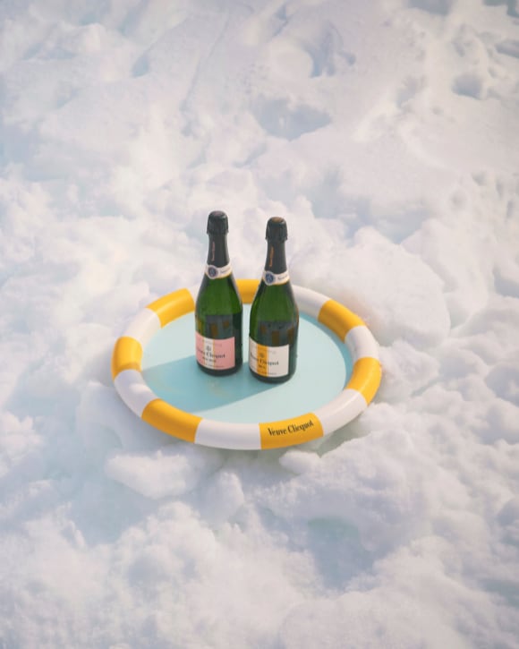 Veuve Clicquot Yellow Cooler and Brut Yellow Label champagne in the snow