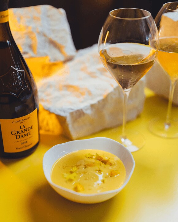 Food pairing with a bottle of La Grande Dame 2015 and a champagne glass