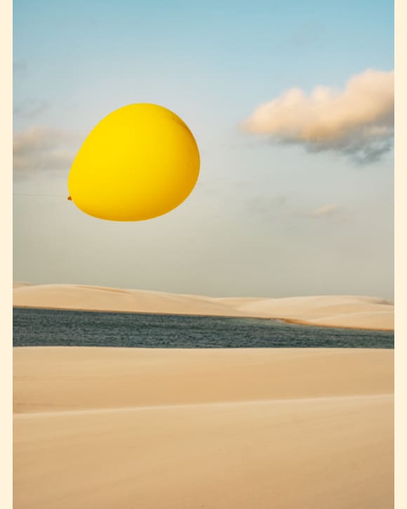 Cristina de Middel photo of a yellow ballon in front of a desert oasis Cristina de Middel photo of a yellow ballon in front of a desert oasis
