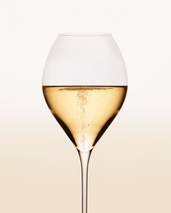 A glass of bubbly Veuve Clicquot Champagne, sparkling wine.