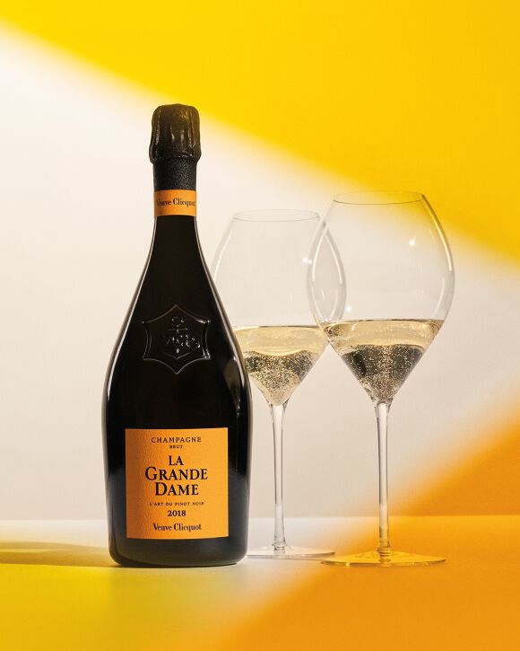 2 glasses of Veuve Clicquot champagne and a La Grande Dame bottle