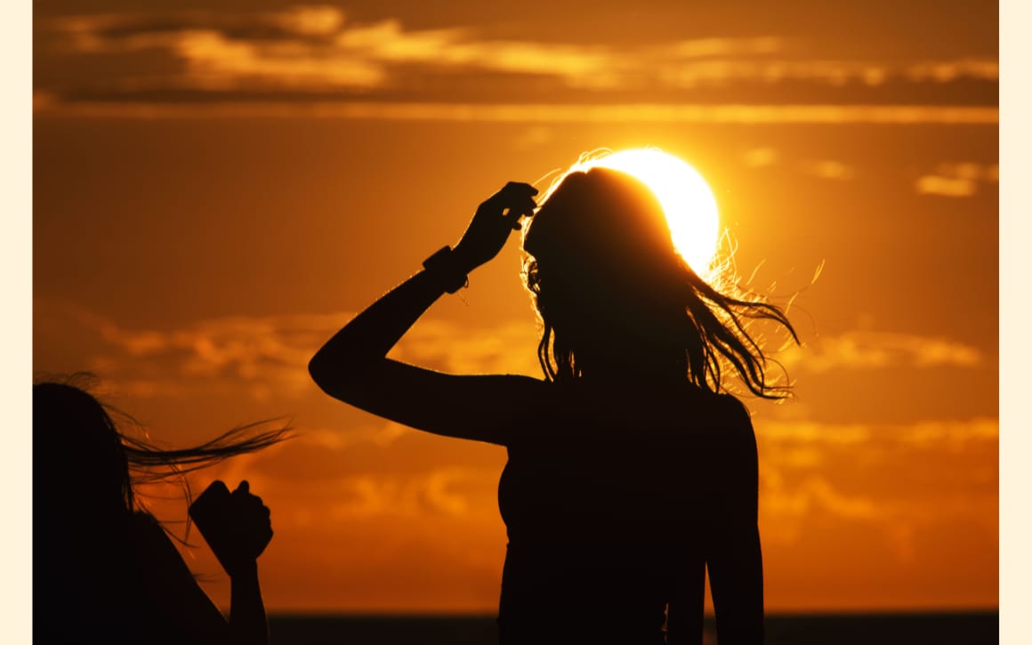 Photo of a woman in front of the sun by Trent Parke for Magnum Photos