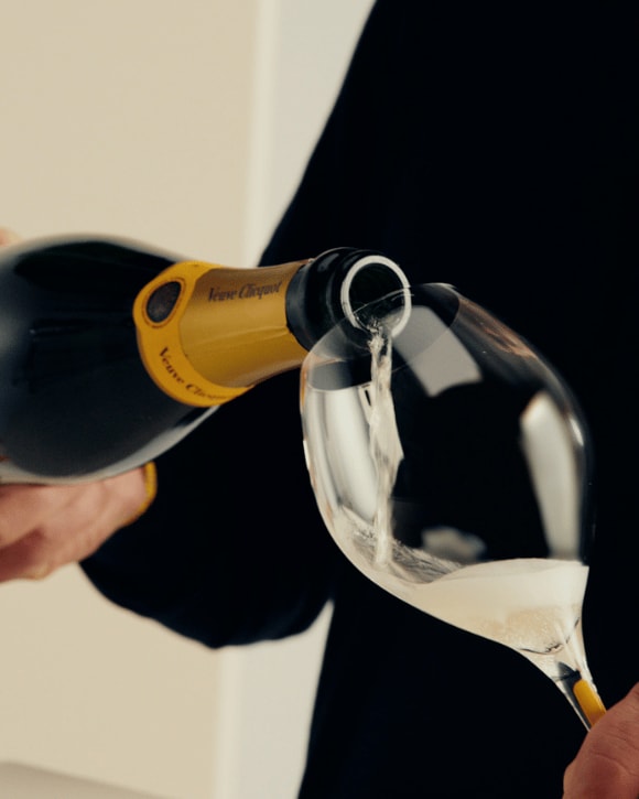 Veuve Clicquot A Clicquot Taste Brut Yellow Label and a glass