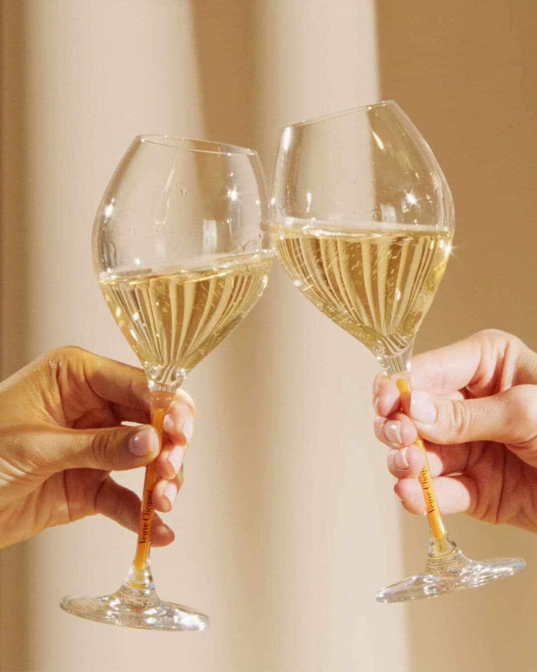 Veuve Clicquot Champagne Glasses Clinking with Brut Yellow Label