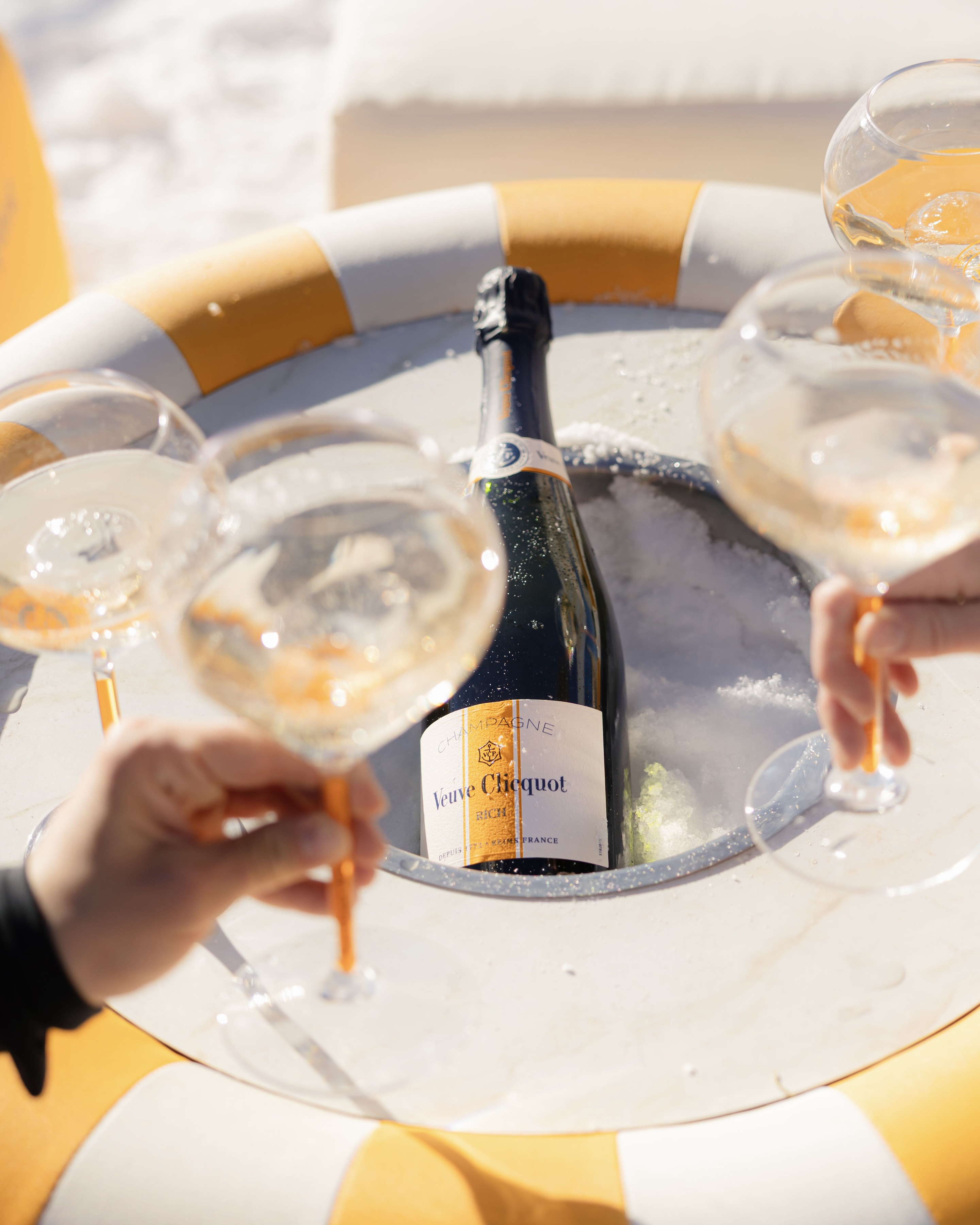 Veuve Clicquot Sun Club Aspen Bottle of RICH with a glass