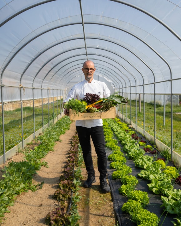 Enrico Crippa with food, a wine glass and a bottle of La Grande Dame 2015 Enrico Crippa with food, a wine glass and a bottle of La Grande Dame 2015