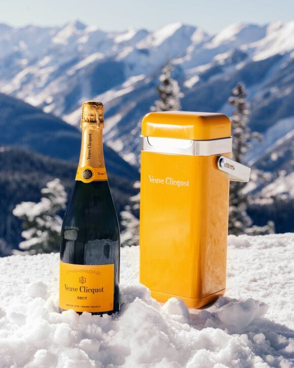 Veuve Clicquot Yellow Cooler and Brut Yellow Label champagne in the snow