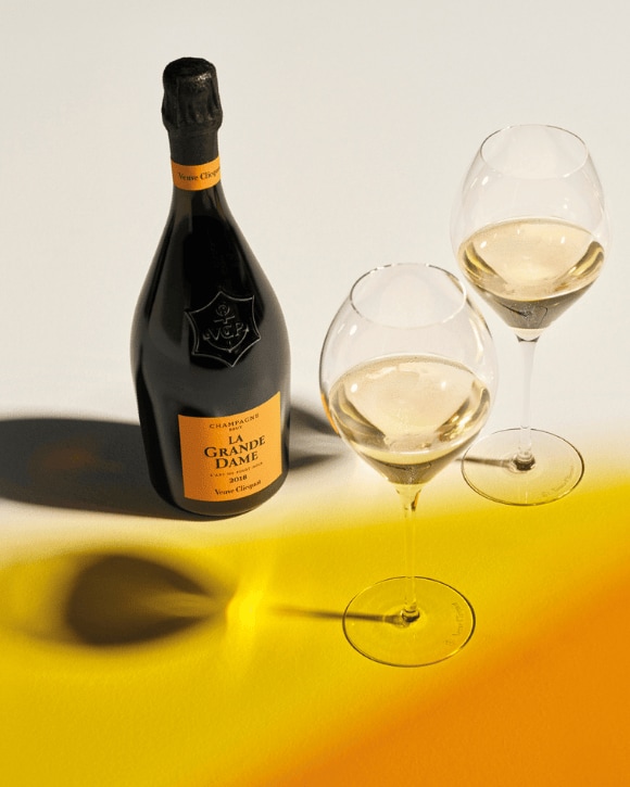 La Grande Dame 2018 bottle and two glasses La Grande Dame 2018 bottle and two glasses