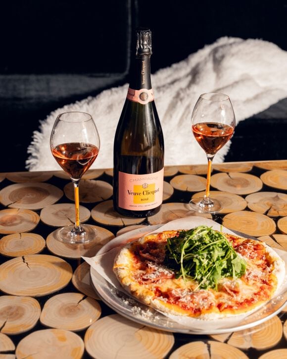 Veuve Clicquot Brut Ros&eacute; with two glasses and a pizza
