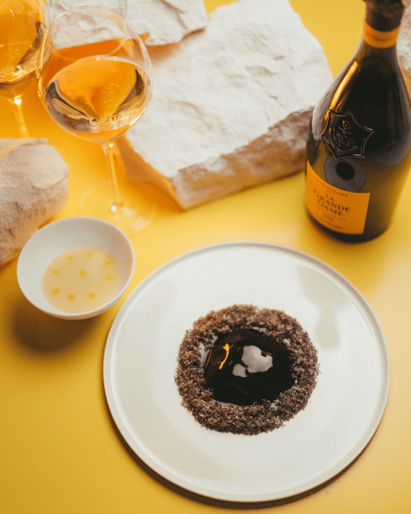 Food pairing with a bottle of La Grande Dame 2015 and a champagne glass