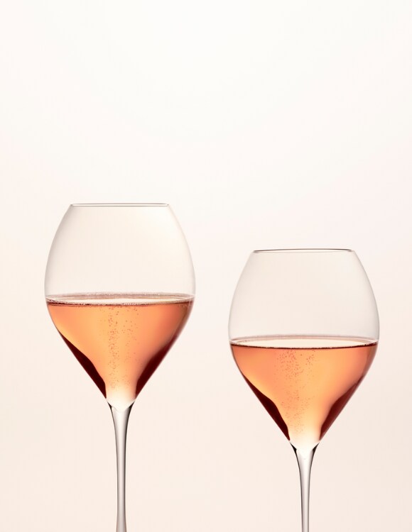 Two full glasses of rosé champagne