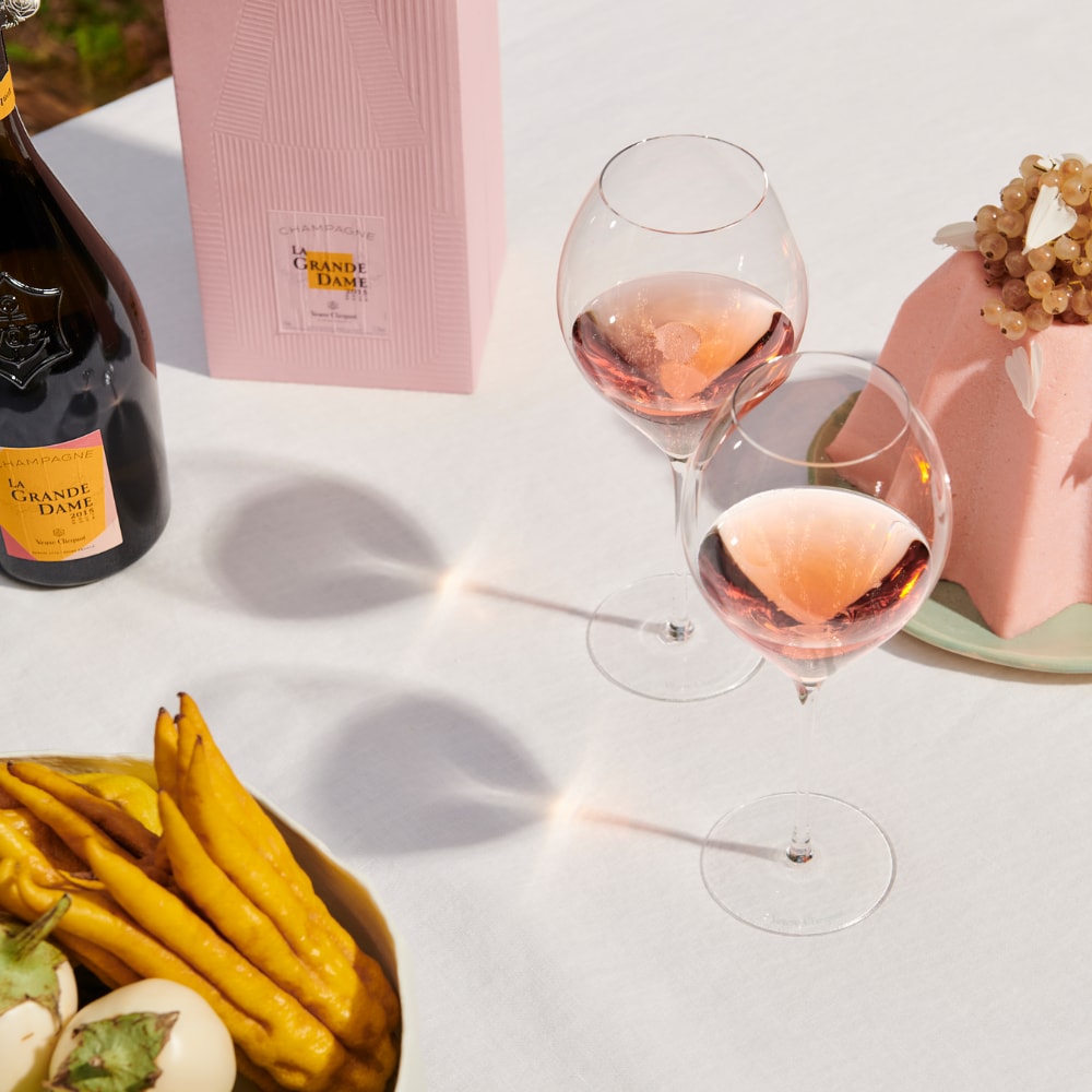 Bottle of La Grande Dame Rosé 2015 with food pairing, giftbow and glasses Bottle of La Grande Dame Rosé 2015 with food pairing, giftbow and glasses