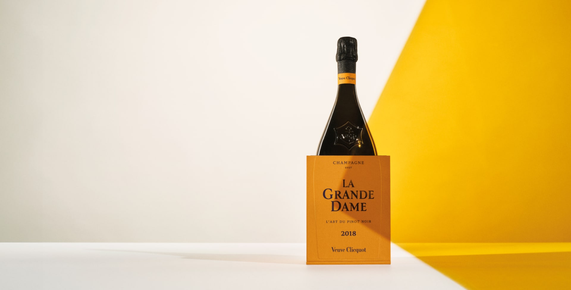 Bottle of La Grande Dame 2018 in its yellow gift box